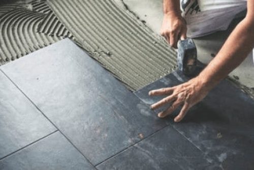 handyman-installing-tile-flooring